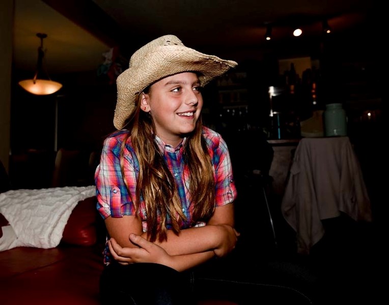 Grace Fahlman recounts her Calgary Stampede experience at her home in Cochrane on Tuesday, July 18, 2017. Fahlman was one of two youth who were chosen to be this year&#8217;s 
