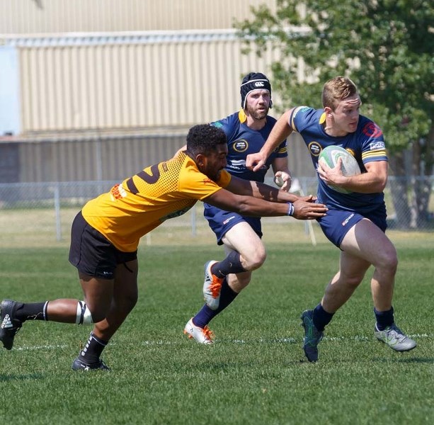 The Bow Valley Grizzlies charge into action during their game against the Calgary Saracens game – which they won with a final score of 17-53 at Calgary Rugby Union on July 29.
