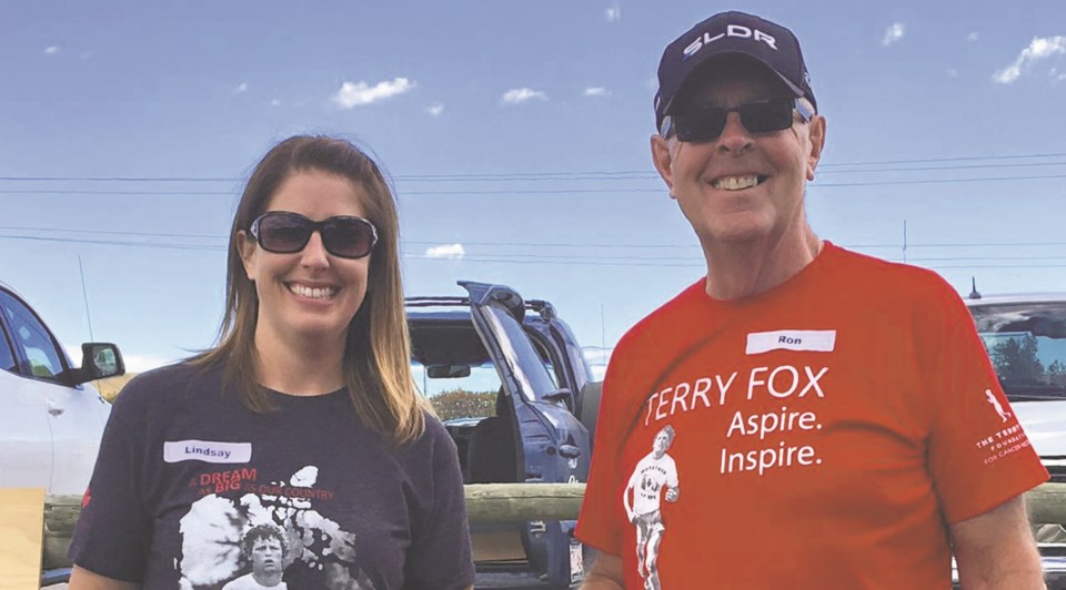 Organizer Lindsay Regier and her father Ron, a cancer survivor, together at last year&#8217;s Terry Fox Run in Cochrane.