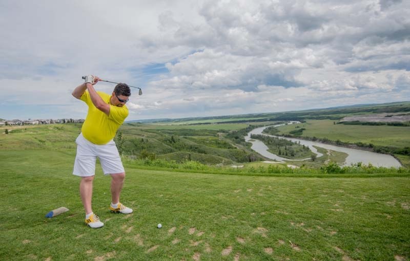 Derek Coderre swings for the green on hole 16 at The Links of GlenEagles in Cochrane on June 17.