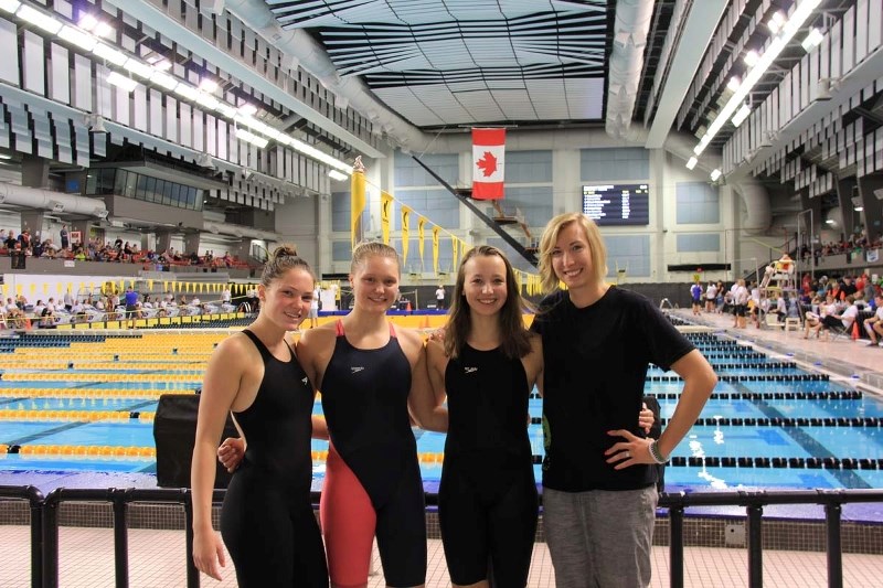 Kennedy Michalski, left, Sarah Nusl, Nicole Gross and coach Breanna Hendriks.