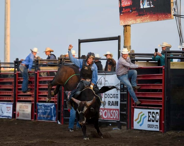 Cody Coverchuck competes in the Cochrane Classic Bull Riding during the Cochrane Fair on the Ag Society Grounds in Cochrane on Aug. 19.
