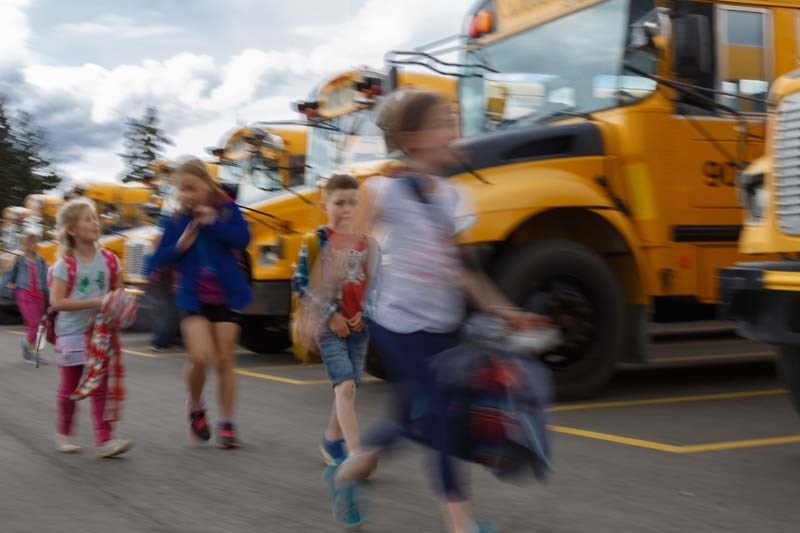 Motorists are urged to use extra caution around buses as the school year begins.
