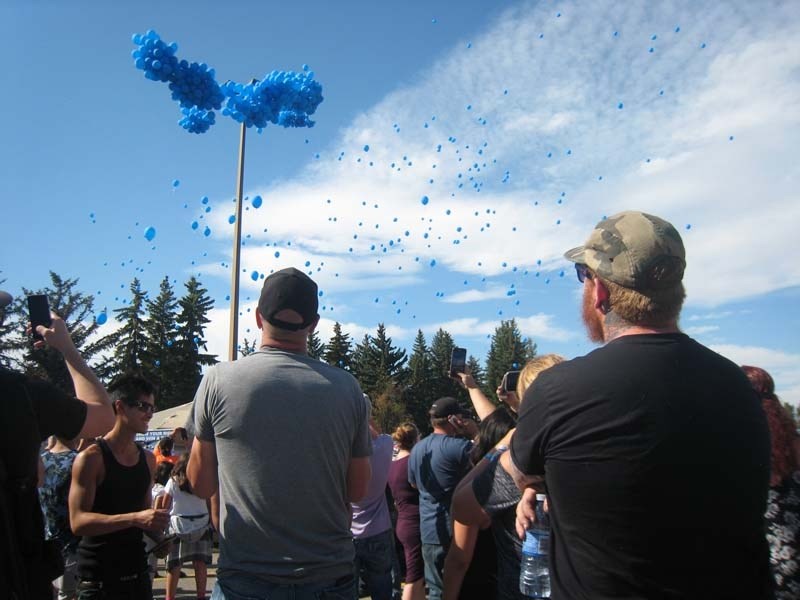 Balloons rise into the sky in honour of Brandon Thomas at the Show Your Ride for Brandon memorial event on Aug. 27.
