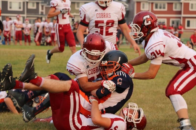 Cobras defence gang tackle a Croxford receiver at the jamboree Aug. 31.