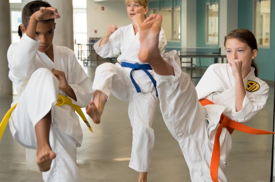 Amy Johnson, 11, participates in a karate demonstration during the SLSFSC Open House in Cochrane on Saturday, Sept. 9, 2017. (Photo by Yasmin Mayne)