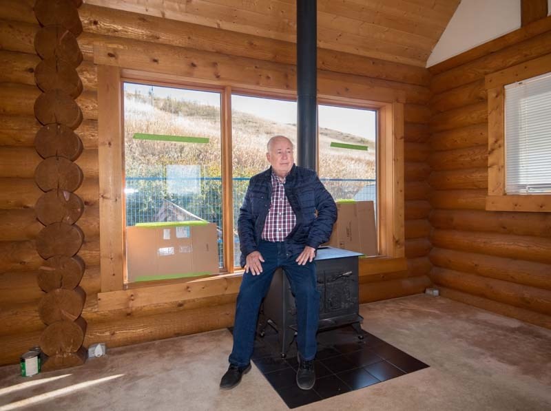 Ken Waddell has bought back the log home he built in the 1980s and will move it to Bearspaw to make room for eventual Highway 1A expansion.