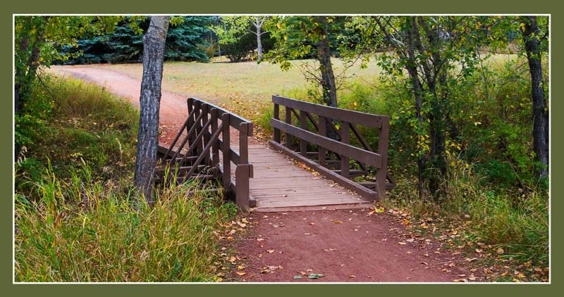 Cochrane&#8217;s red shale pathway system brings communities together like thread for a string of pearls, a reminder to walk our talk about neighbourliness.