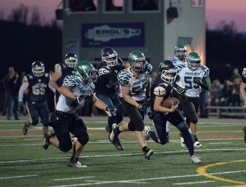 Bow Valley Bobcat Austin Javorsky makes a break toward the end zone during a regular season game against the Springbank Phoenix at the Spray Lake Legacy Field in Cochrane on