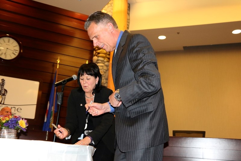 Coun. Alex Reed is sworn in on Monday.