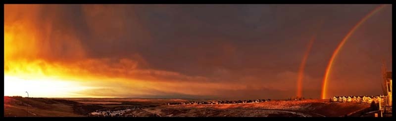 This nearly 180-degree sunrise-to-rainbow panorama on a surprisingly rainy late-November morning in the Bow Valley inspired Vistas of Gleneagles residents Gary and Sandy