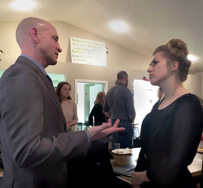 After the Youth Council meeting on Dec. 14, Mayor Jeff Genung took the time to chat with youth council members including Mackenzie Drake.