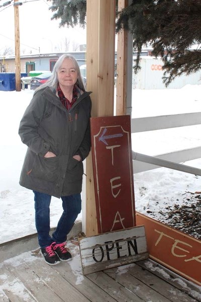 Kelly Joyner stands in front of the sign to her storefront shop Tea Hippie, formerly known as Tea … And Other Things.