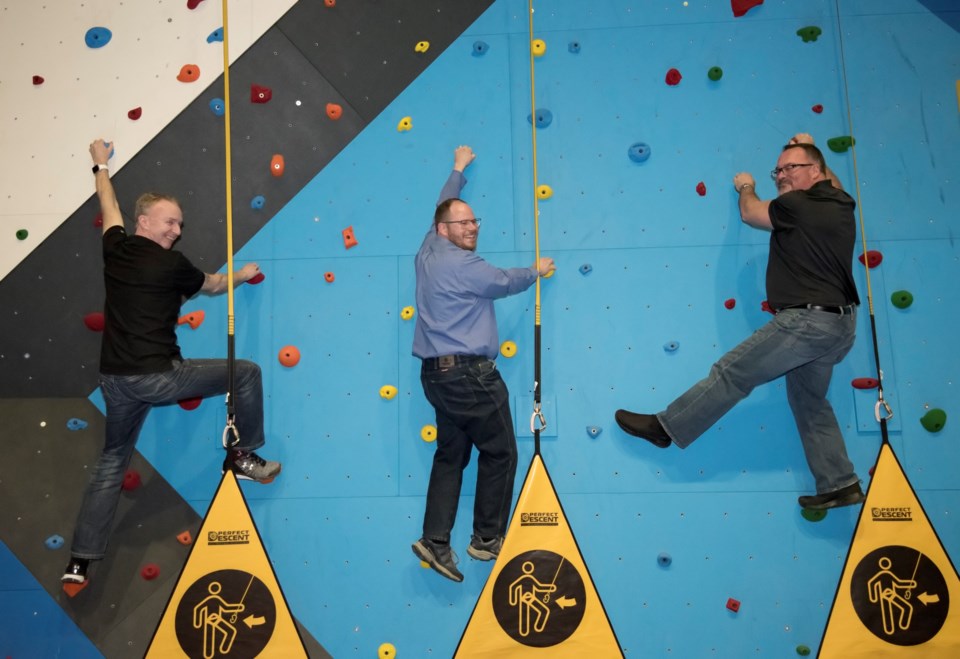 Banff-Cochrane MLA Cameron Westhead, centre, with Spray Lake Sawmills Family Sports Centre (SLSFSC) assistant GM Brain Neave, left, and GM Robin Mitchell on the new climbing