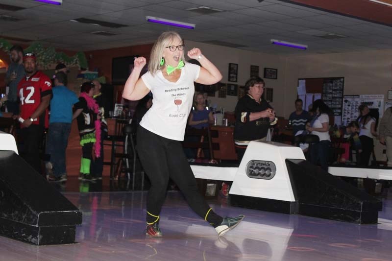 Lisa Heier of Reading Between The Wines bowl during the Big Brothers Big Sisters of Calgary and Area Bowl For Kids Sake event at Cochrane Lanes on Sunday.