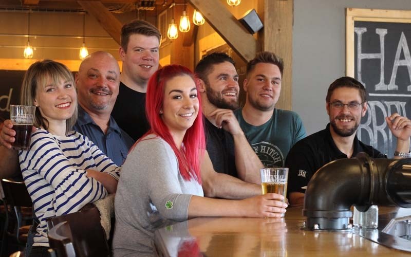 The family and some employees pose with Papa Bear (second to right, Mike Heier). From left to right Brittany Kozloski, Mike Heier, Jonathan Babin, Amber Finlay, Kyle Heier,