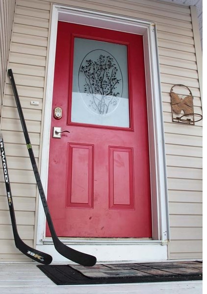 Cochrane photographer and hockey dad, Bill Marsh, was one of many Cochranites who placed hockey sticks on their front porch joining families across the nation to quietly