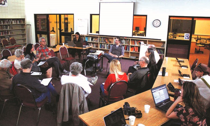 Ipsos Reid&#8217;s Jamie Duncan facilitates a transit cafe at Cochrane High School in April.