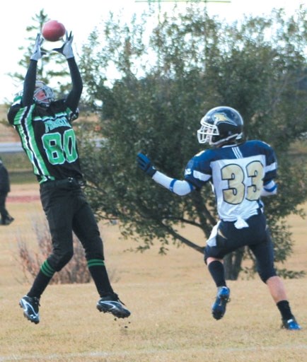 Springbank Phoenix receiver Luke Jackson goes up for a touchdown catch over Bow Valley Bobcats defender Cole Wangen at Springbank Oct. 4.