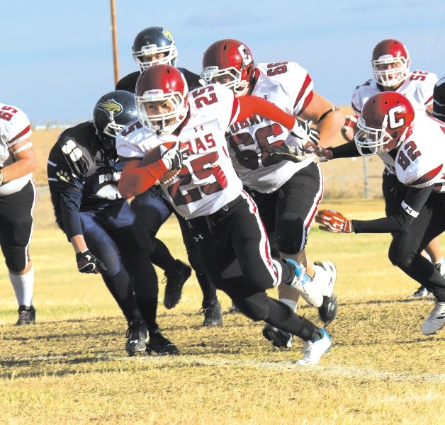 Cobras tailback Justin Mount rolls up some yards against Bow Valley Bobcats Oct. 12.