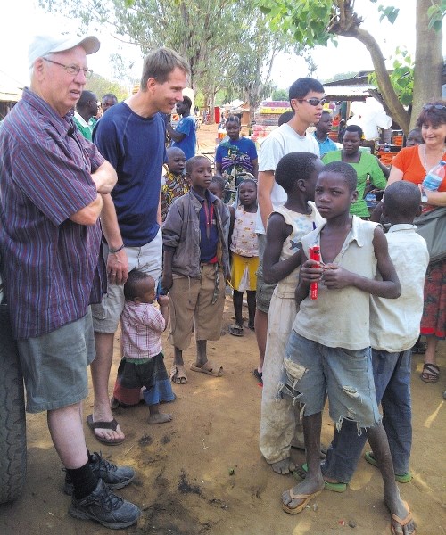 Reg Gustafson, left, of Bearspaw helped the Efeso Baptist Church in Tanzania with engineering plans to expand its school for children.