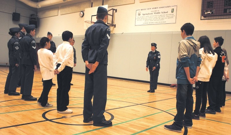 Flight Sgt. Dunnell Jones shows the 952 &#8216;WestJet&#8217; Royal Canadian Air Cadet Squadron some basic drills in the Springbank Middle School gymnasium on Oct. 18.