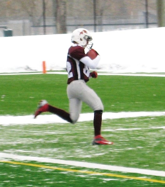 Cochrane Lions receiver Cole Avery crosses the goal line for a touchdown against Airdrie Storm in Calgary Bantam Football Association Division 2 playoff action Oct. 27 at