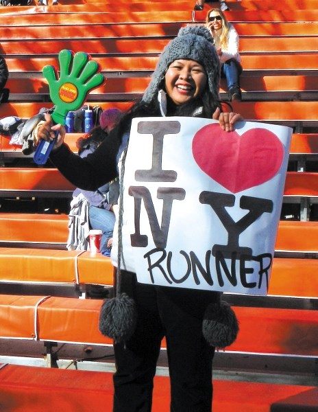 New Yorker supports runners who came for the New York Marathon, which was cancelled.