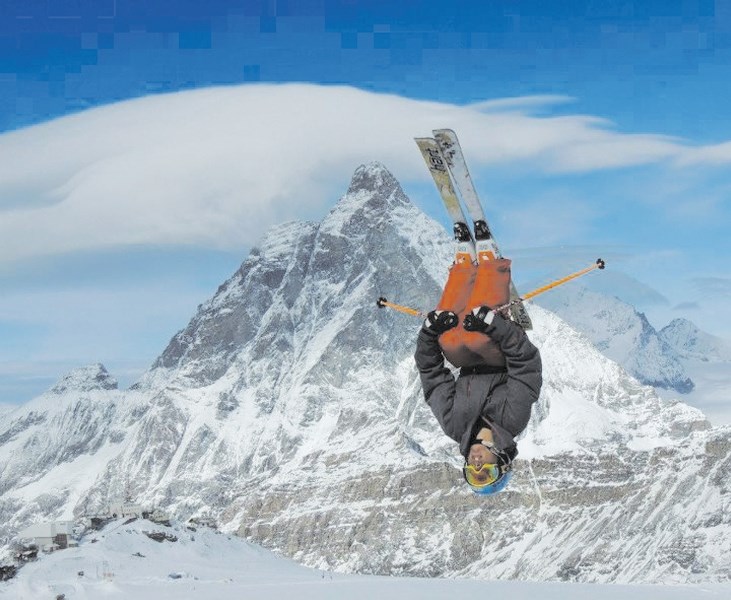 Cochrane freestyle moguls skier Ryan Portello flies the friendly skies over the Swiss Alps, with the Matterhorn in the background, during Team Alberta freestyle training in