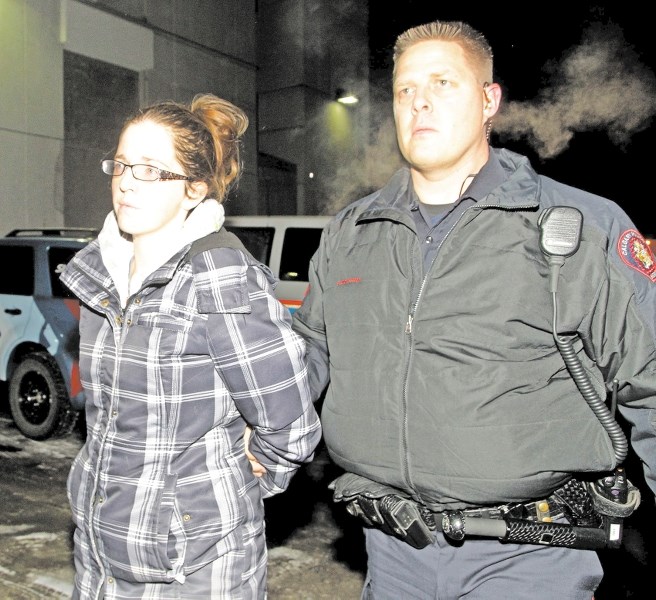 Sheena Rempel is taken into custody Nov. 29.