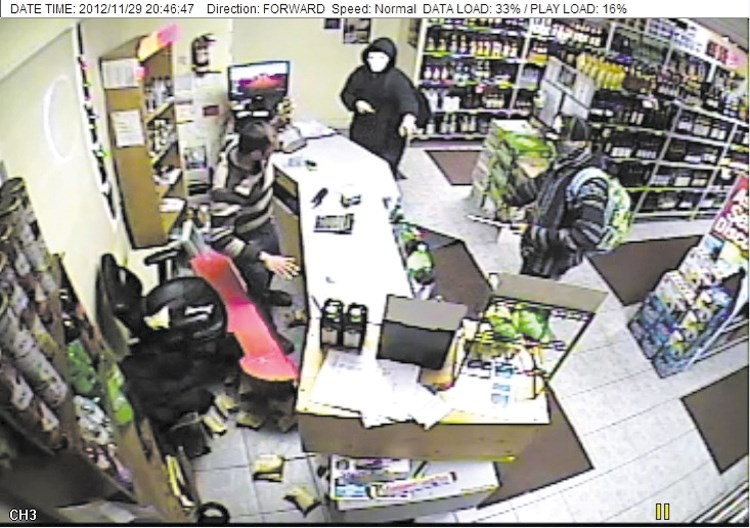Cochrane RCMP are searching for two suspects in connection with a robbery at Late Hours Liquor on Nov. 29.
