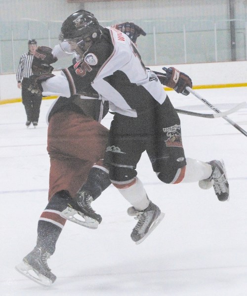 The Generals defeated the Wranglers 7-3. Generals forward Reed Boothby and Wranglers forward Dylan Wiedmer collide at centre ice.