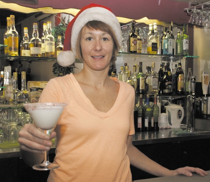 Bartender Andrea Latendresse will be serving up pints and festive cocktails — like the Santa&#8217;s Milk Martini — down at The Hideout Pub.