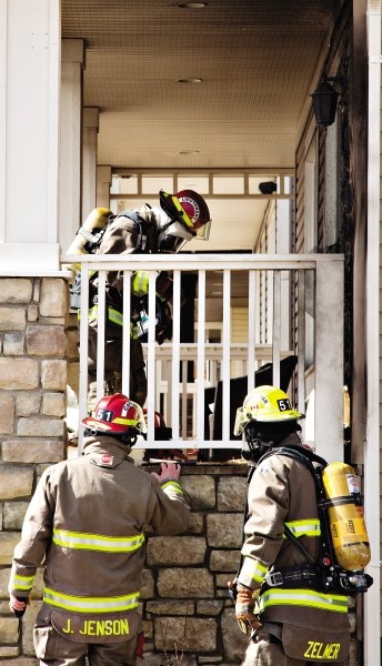 Cochrane Fire Services responding to a house fire call in Heritage Hills in April 2012. Neighbours had extinguished the fire by the time crews arrived on scene. The