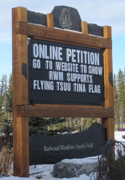 A sign at the entrance to Redwood Meadows publicizing petition campaign.