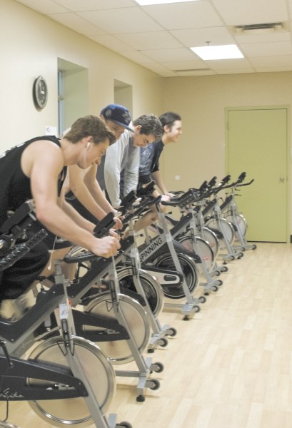 From left, Spencer Gordon, Brayden Thorogood, Sam Yetman and Jessy Gentes try out the spin bikes at Lifestyles Fitness and Wellness Centre, located on the second floor of the 