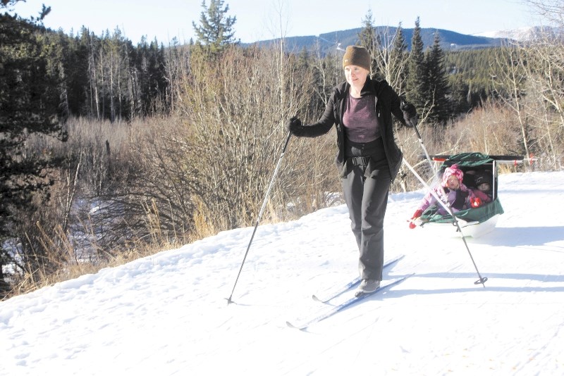 Becky Cryne hauls two of her children along the Mountain Road at West Bragg Creek on Jan. 5. West Bragg Creek provides 45 kilometres of trials as well as a designated