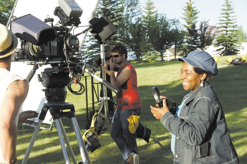 Kathryn Fasegha, writer, director and producer of Treacherous Heart, laughs behind the scenes during the making of the film.