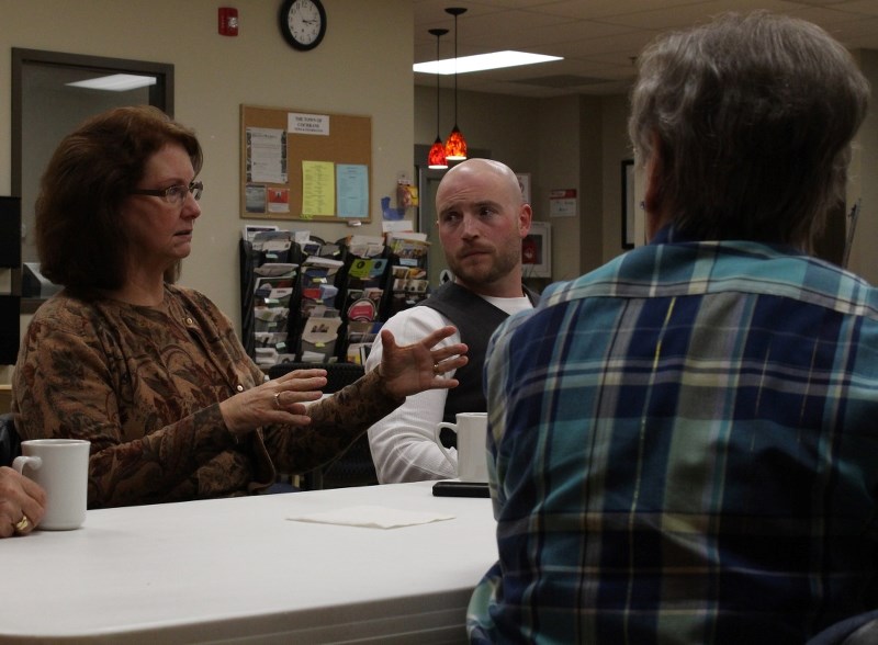 Cochrane mayor Truper McBride, right, listens to councillor Joann Churchill as she speaks during &#8216;coffee with the mayor&#8217; at Seniors on the Bow.