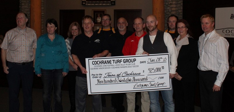 Members of the Turf Association present the Cochrane mayor and councillors with a cheque for $925,000 during the Jan. 28 council meeting to go toward the construction of a