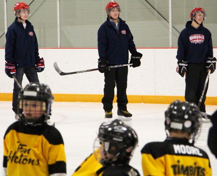 Cochrane Generals (from left) Logan Brown, Craig Packard and Dan Bunnah stand ready during a Cochrane Minor Hockey initiation session for 4-6-year-old players Feb. 4 at Spray 
