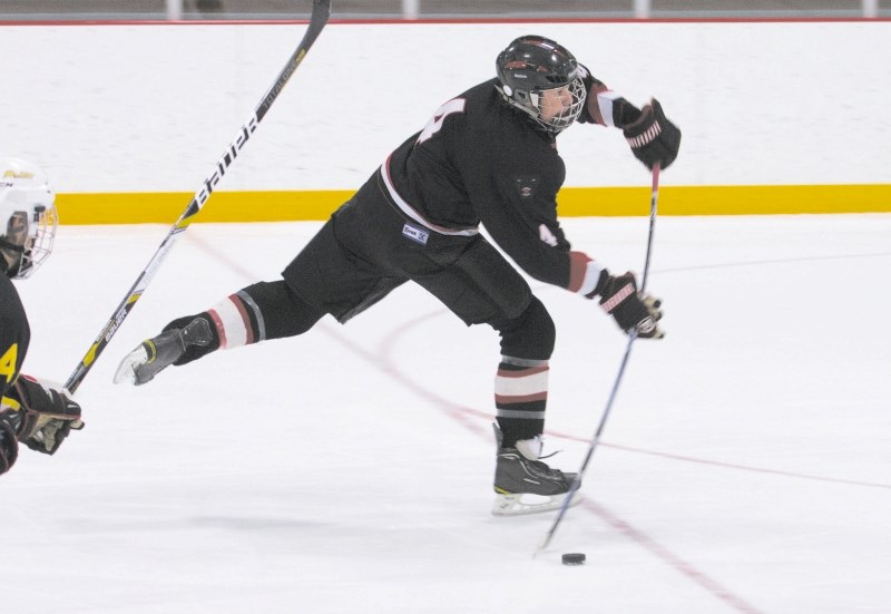 Bow Valley Timberwolves&#8217; Dustin Ponath lets one fly against the Calgary Bruins in South Central Alberta Hockey League Midget AA play Feb. 9 at Spray Lake Sawmills