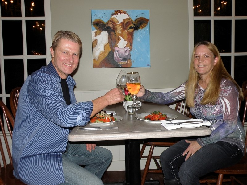 Taste of Bragg Creek event coordinators Jane Boyce and Charlie Holschuh, toast to the success of the upcoming kick-off to Dine in Bragg Creek, at the newly renovated The