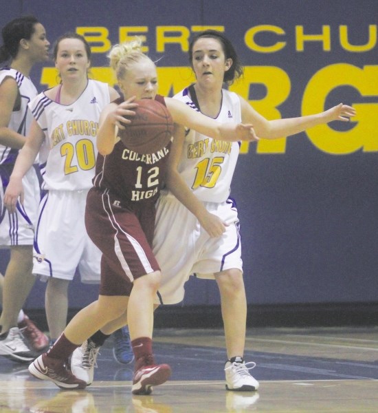 Cochrane High School Cobras&#8217; Mikaela McNab carries the play to the Bert Church Chargers in Rocky View Sport Association (RVSA) junior-varsity girls basketball play