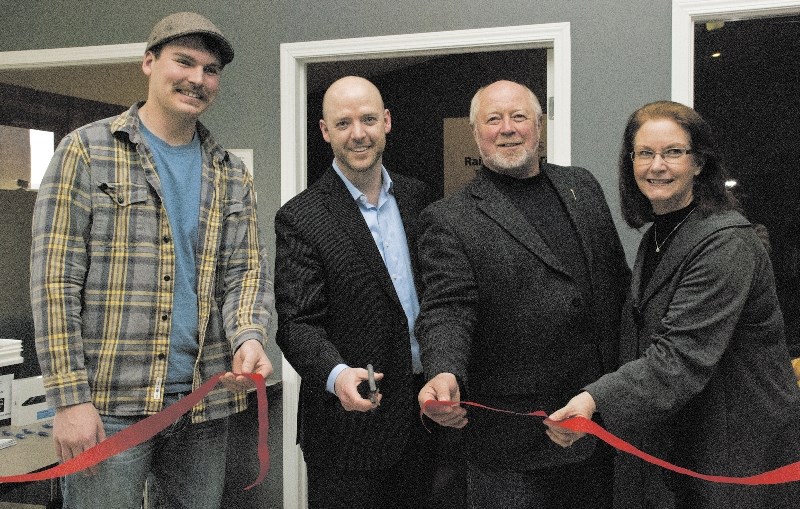 From left, the Boys and Girls Club of Cochrane and Area&#8217;s Connor Noyes; Darrell Graham of Rogers Communications; Ron Casey, MLA for Banff-Cochrane; and town councillor