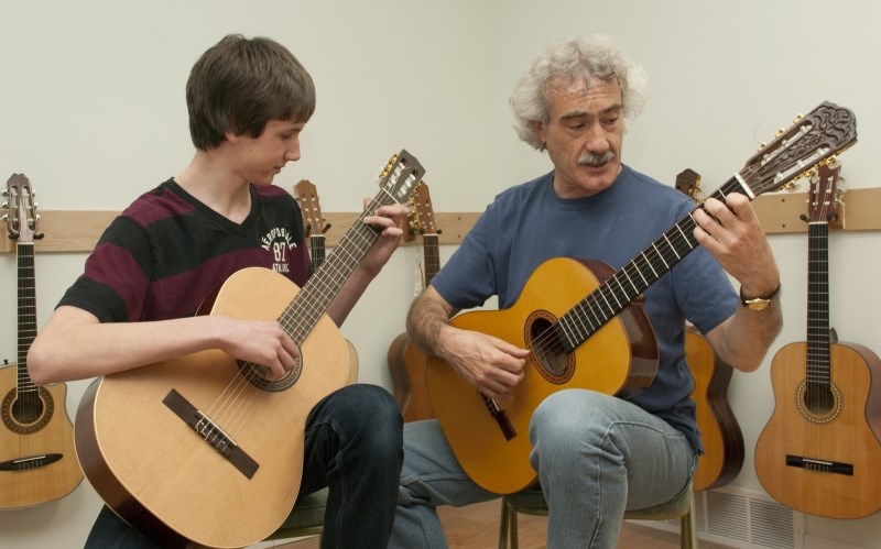 Derek Wieliczko works with instructor Martin Russell. Wieliczko was recognized on April 14 for earning Alberta&#8217;s top score on the Grade 3 guitar examination from the