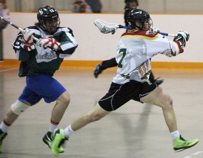 Rockyview Silvertips&#8217; Cordell Lee of Cochrane prepares to unload a shot while being chased by Okotoks Marauders defender Kaleb Burnett in Rocky Mountain Lacrosse League 