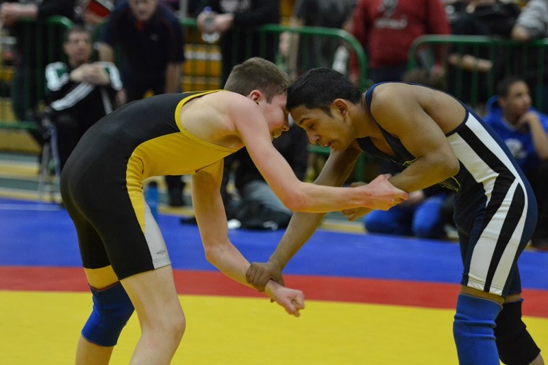 Cochrane Cowboys wrestler Callum McNeice (left) goes to work at the Canada Summer Games qualifying meet April 20 in Wetaskiwin. He qualified to wrestle at the Summer Games in 