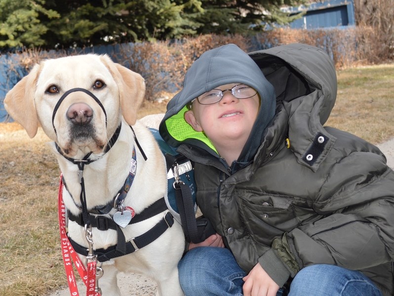 Jakob Furdal and his service dog Merlot share a bond that will help him gain independence. Jakob&#8217;s father Ken hopes to raise $40,000 for Dogs with Wings Assistance Dog