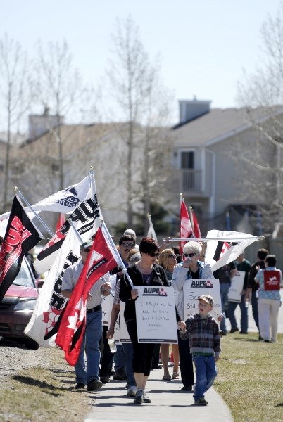 More than 100 protesters were on hand for the Alberta Union of Provincial Employees demonstration in front of the Bethany Care Centre May 4 in Cochrane to protest the new